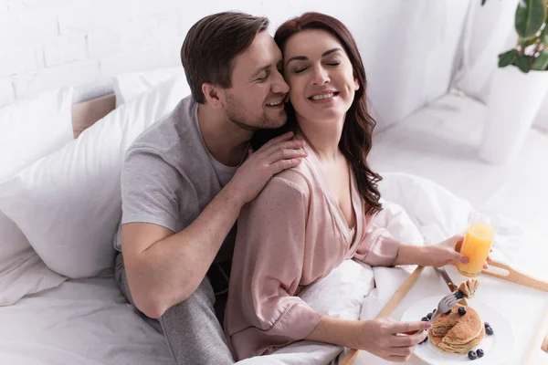 Adult Man Embracing Wife Pancakes Orange Juice Bed — Stock Photo, Image