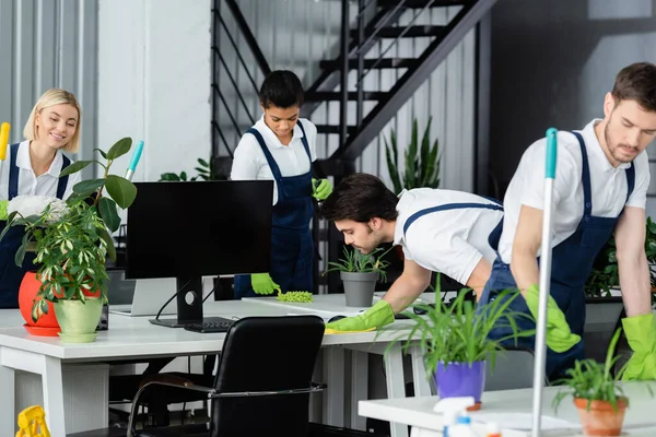 Multiethnic Cleaners Uniform Working Computer Plants Office — Stock Photo, Image