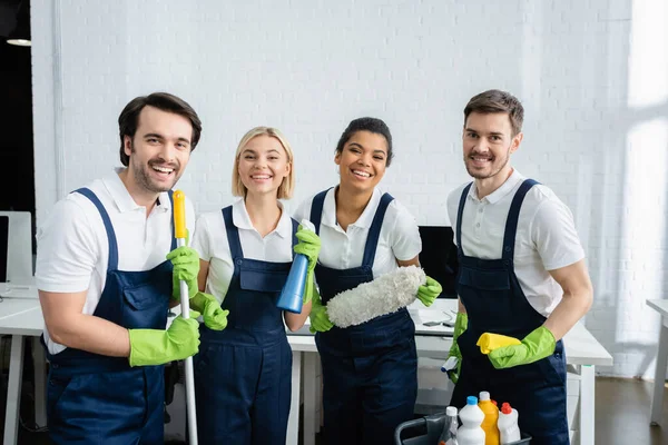 Positive Interracial Cleaners Holding Supplies Office — Stock Photo, Image