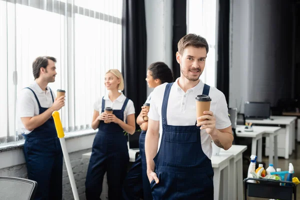 Smiling Worker Cleaning Company Paper Cup Looking Camera Multiethnic Colleagues — Stock Photo, Image