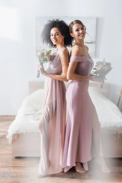 Elegant Multicultural Bridesmaids Holding Wedding Bouquets While Standing Back Back — Stock Photo, Image