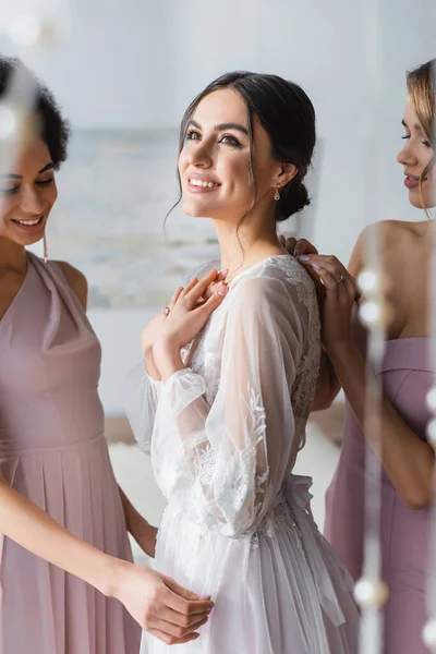 Happy Dreamy Bride Looking Away Smiling Bridesmaids Blurred Foreground — Stock Photo, Image