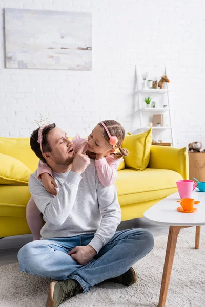 Father Touching Nose Cheerful Daughter While Playing Prince Princess Home — Stock Photo, Image