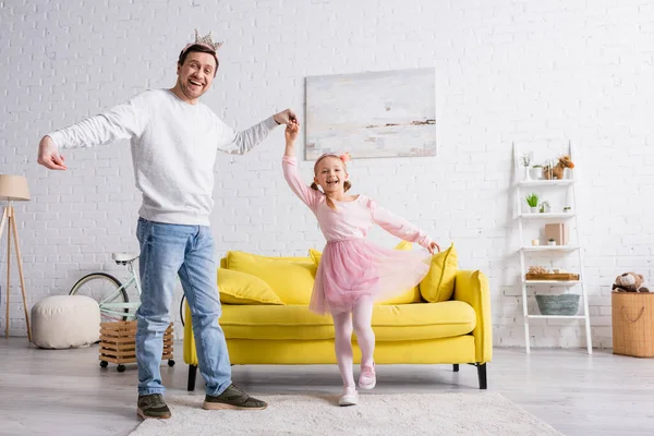 Happy Father Daughter Toy Crowns Smiling Camera While Dancing Living — Stock Photo, Image