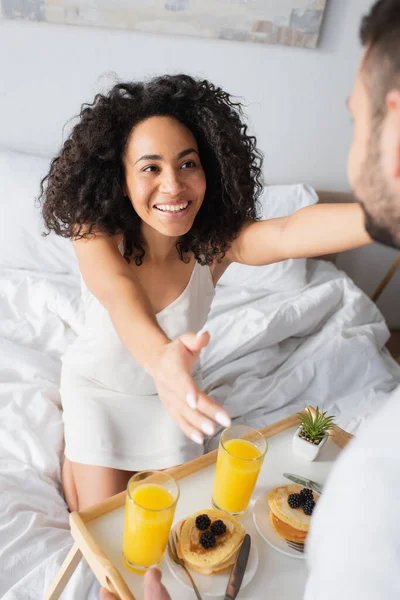 Happy African American Girlfriend Outstretched Hands Blurred Man Holding Tray — Stock Photo, Image