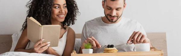 Happy African American Holding Book Boyfriend Having Breakfast Bed Banner — Stock Photo, Image