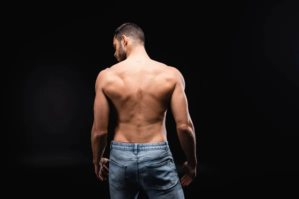 Back View Shirtless Homem Muscular Jeans Fundo Preto — Fotografia de Stock