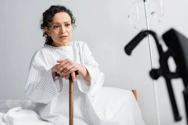 Upset African American Woman Sitting Hospital Bed Walking Stick Blurred — Stock Photo, Image