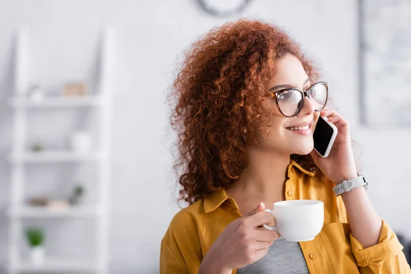 Happy Freelancer Eyeglasses Holding Coffee Cup While Calling Moblie Phone — Stock Photo, Image