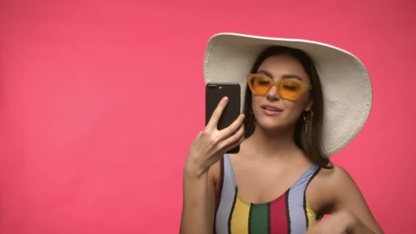 Woman Sun Hat Sunglasses Taking Selfie Isolated Pink Stock Video