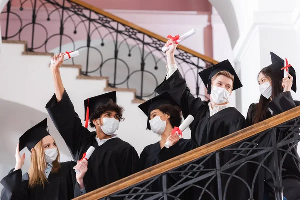 Multicultural Bachelors Protective Masks Holding Diplomas Railing University — Stock Photo, Image