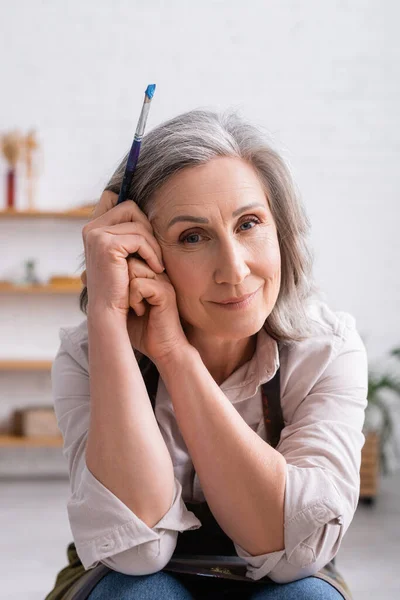 Happy Middle Aged Painter Grey Hair Holding Paintbrush — Stock Photo, Image