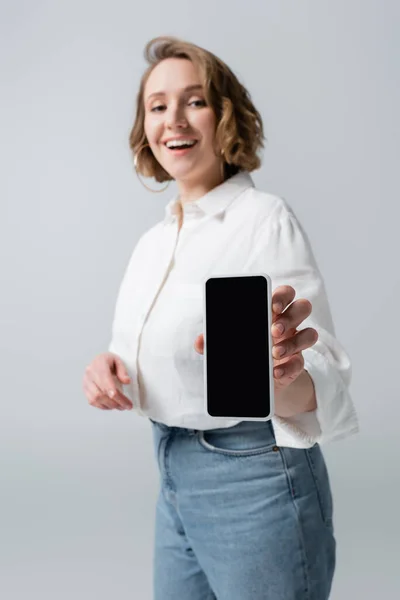 Blurred Overweight Woman Holding Smartphone Blank Screen Smiling Isolated Grey — Stock Photo, Image