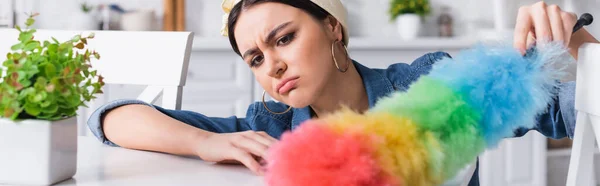 Upset Housewife Holding Blurred Dust Brush Kitchen Table Banner — Stock Photo, Image