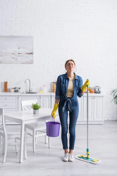 Displeased Housewife Holding Bucket Mop Kitchen — Stock Photo, Image