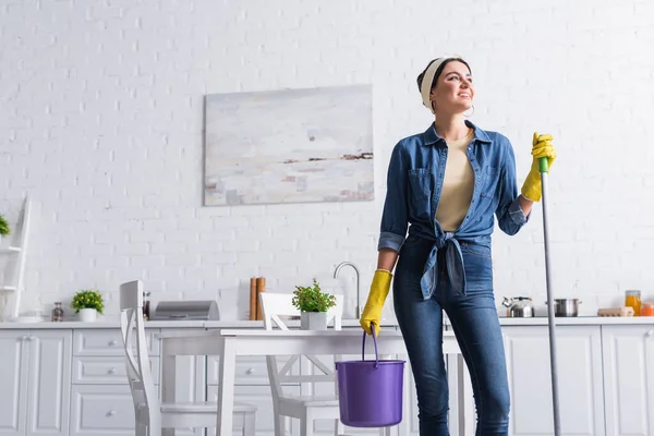 Cheerful Woman Rubber Gloves Holding Mop Bucket Kitchen — Stock Photo, Image