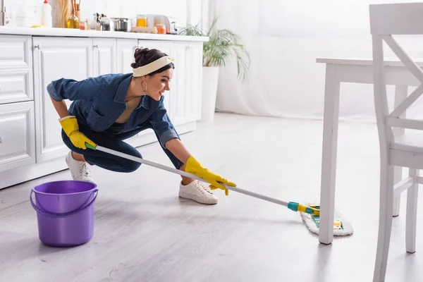 Positive Housewife Denim Shirt Washing Kitchen Floor — Stock Photo, Image