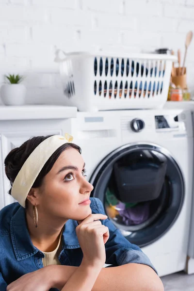 Dreamy Housewife Sitting Blurred Washing Machine Kitchen — Stock Photo, Image