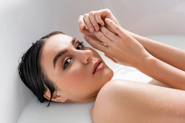 Pretty Woman Holding Hands Face While Relaxing Bath Milk — Stock Photo, Image