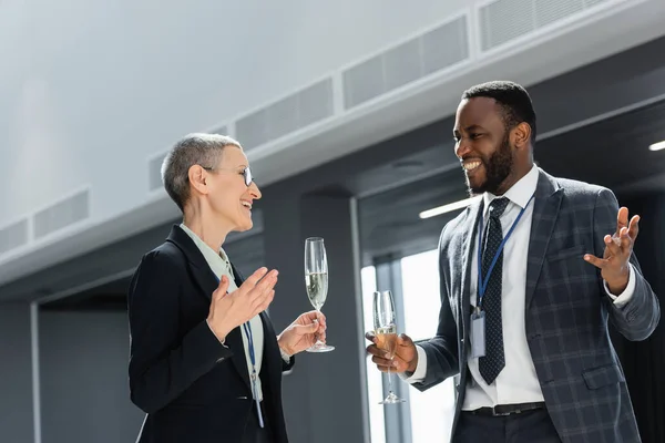 Cheerful Multicultural Business People Holding Champagne Discussion Conference — Stock Photo, Image