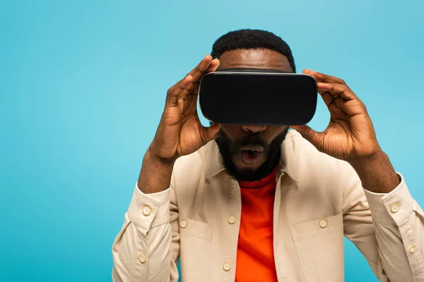 Shocked African American Man Touching Headset While Gaming Isolated Blue — Stock Photo, Image