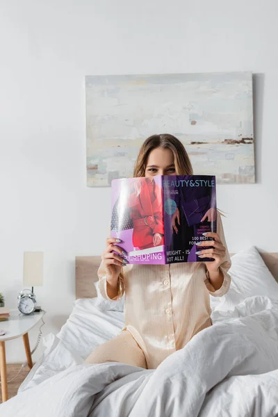 Woman Covering Face Magazine Bed — Stock Photo, Image