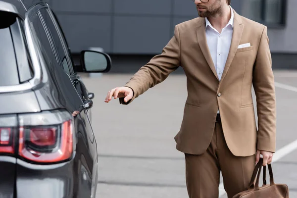 Partial View Man Beige Suit Glasses Reaching Car Door — Stok Foto