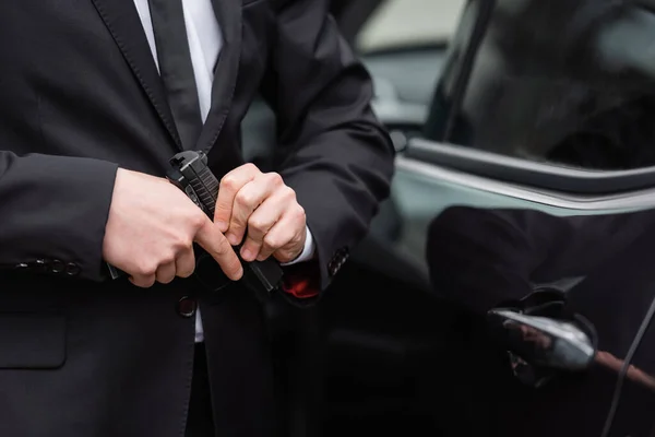 Cropped View Safeguard Suit Holding Gun Blurred Modern Auto — Stock Photo, Image