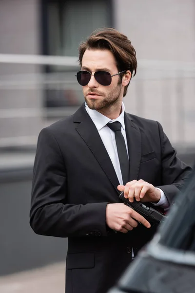 Bearded Bodyguard Sunglasses Holding Gun Blurred Auto — Stock Photo, Image