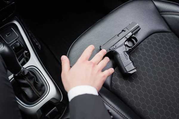 Top View Bodyguard Reaching Gun Seat Modern Automobile — Stock Photo, Image