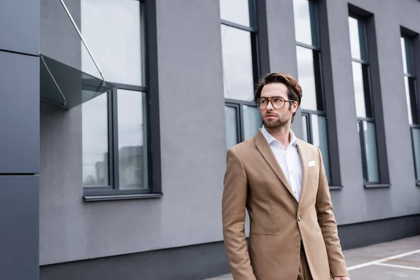 Bearded Businessman Glasses Beige Coat Modern Building — Φωτογραφία Αρχείου