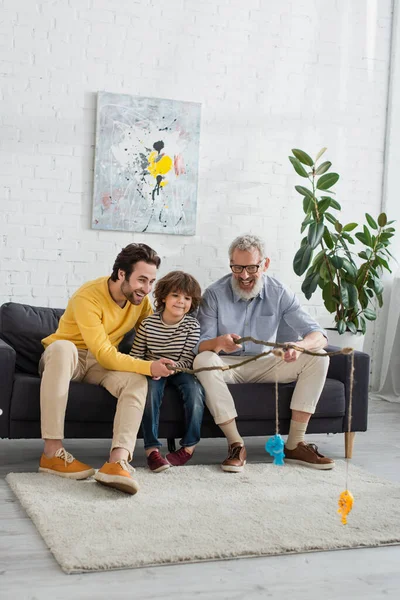 Smiling Men Kid Playing Fishing Living Room — Stock Photo, Image