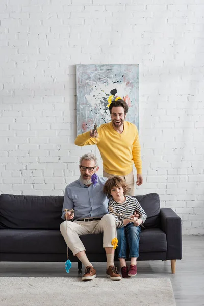 Parents Shocked Kid Playing Toy Fishing Couch Living Room — Stock Photo, Image