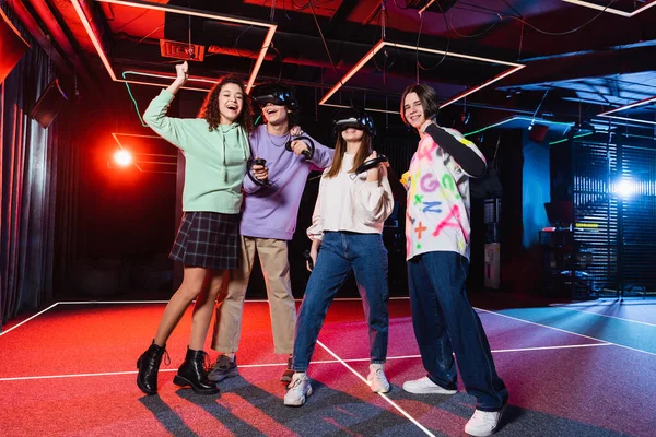 Interracial Teenagers Showing Win Gesture Friends Headsets — Stock Photo, Image