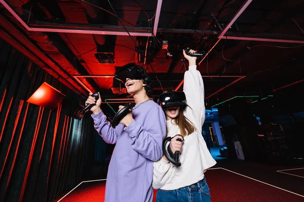 Excited Girl Showing Success Gesture Friend Game Room — Stock Photo, Image