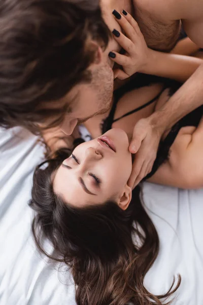 Blurred Man Touching Sensual Girlfriend Closed Eyes Bed — Stock Photo, Image