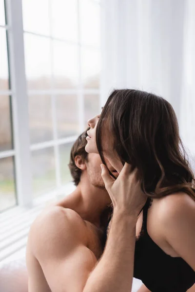 Muscular Man Kissing Girlfriend Bra Bedroom — Stock Photo, Image