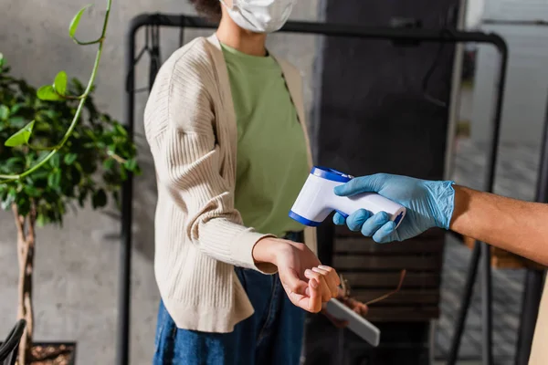 Cropped View African American Waiter Latex Glove Holding Infrared Thermometer — Stock Photo, Image