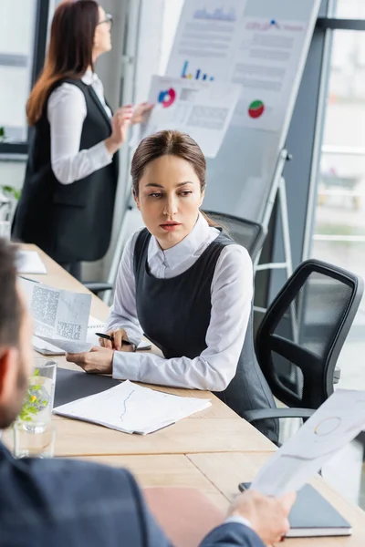 Blurred Businessman Showing Paper Colleague Office — Stock Photo, Image