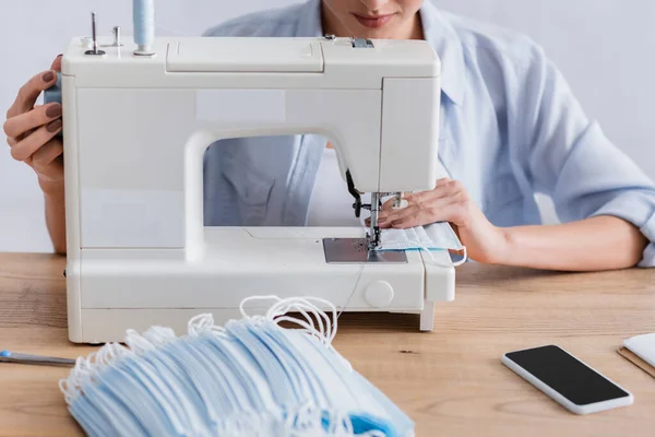 Cropped View Seamstress Sewing Protective Mask Cellphone Table — Stock Photo, Image