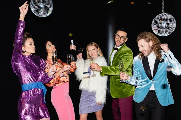 Positive Multiracial Friends Colorful Clothes Holding Glasses Champagne Dancing Black — Stock Photo, Image