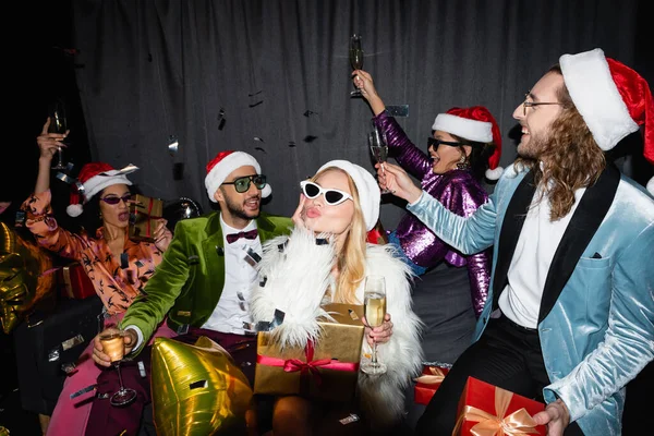 Playful Interracial Friends Santa Hats Drinking Champagne Celebrating New Year — Stock Photo, Image
