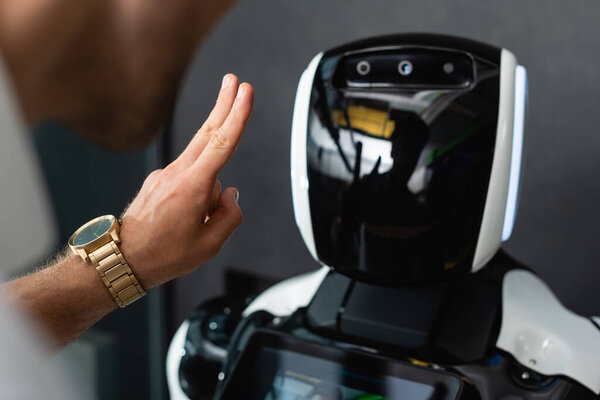 Cropped View Businessman Showing Victory Gesture Robot Office Royalty Free Stock Photos