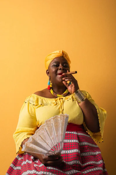 Middle Aged African American Woman Bright Clothes Sitting Fan Smoking — Stock Photo, Image