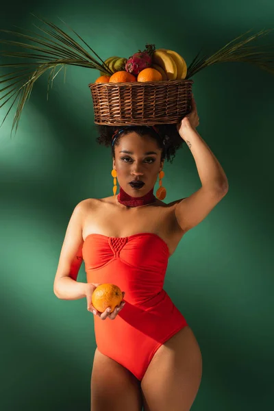 Young African American Woman Red Swimsuit Holding Basket Exotic Fruits — Stock Photo, Image