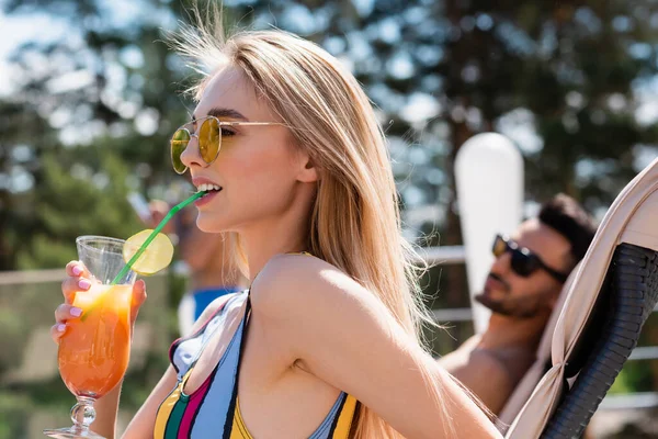 Woman Sunglasses Swimsuit Drinking Cocktail Outdoors — Stock Photo, Image