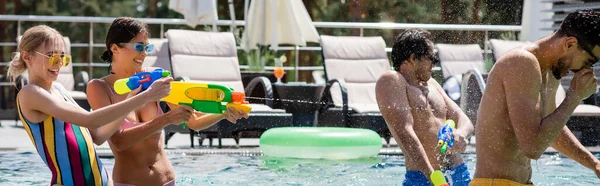 Cheerful Women Playing Water Guns Interracial Men Swimming Pool Banner — Stock Photo, Image