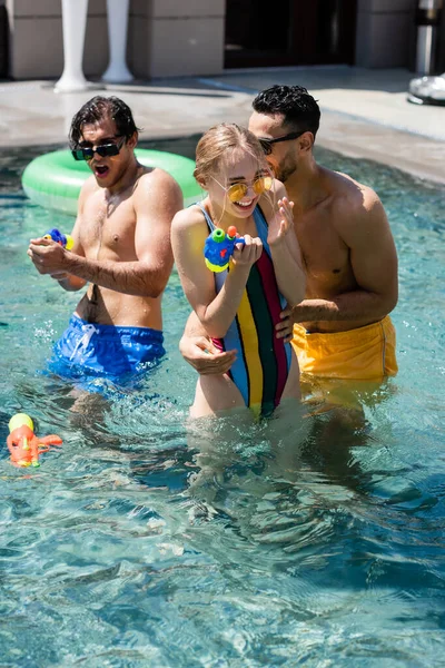 Joyful Interracial Friends Playing Water Pistols Swimming Pool — Stock Photo, Image