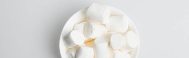 top view of soft and puffy marshmallows in bowl on white, banner clipart