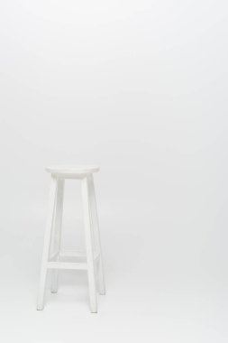 high wooden stool on white background clipart